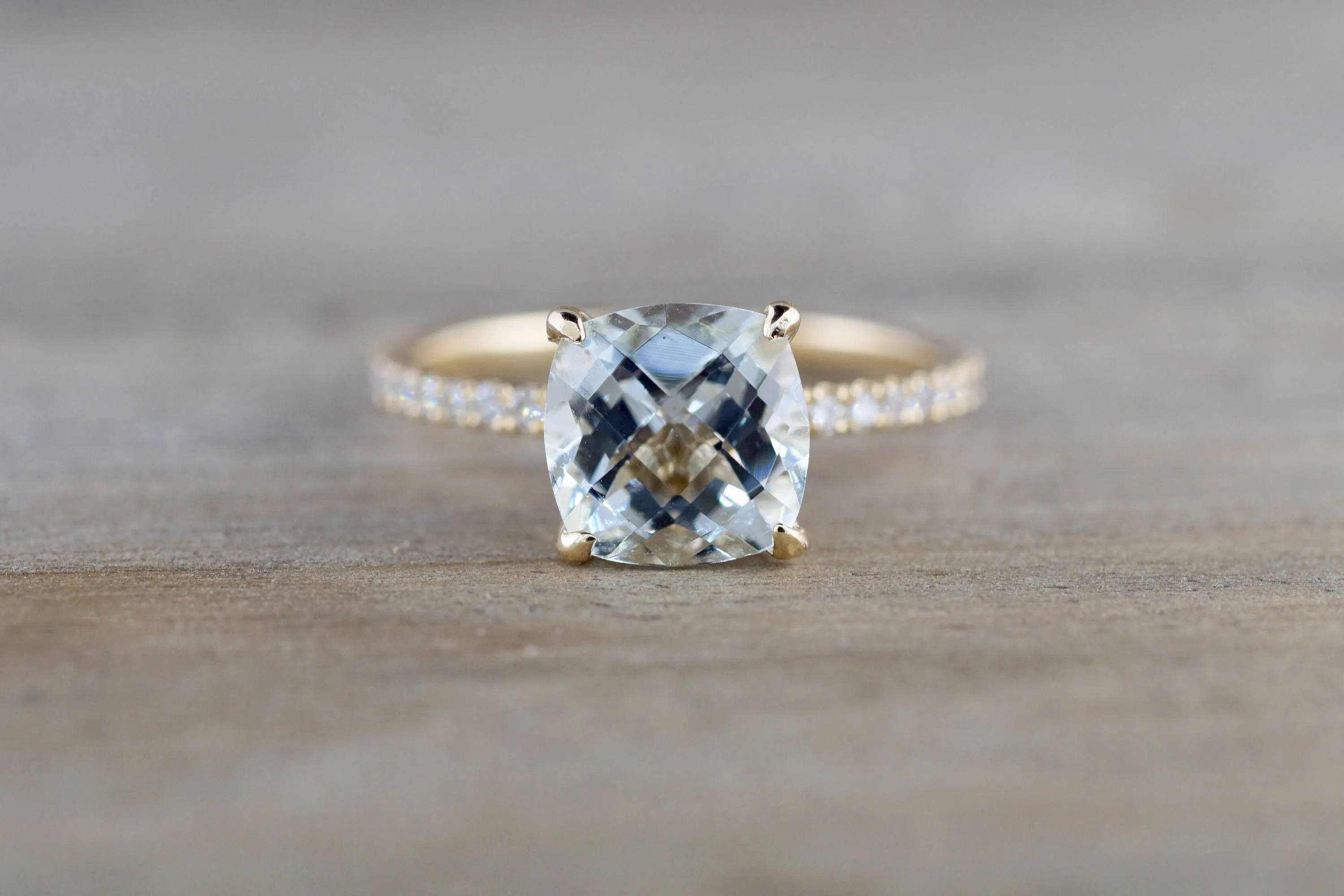 14k Yellow Gold Cushion Checkerboard Aquamarine set in a diamond mounting 8x8mm